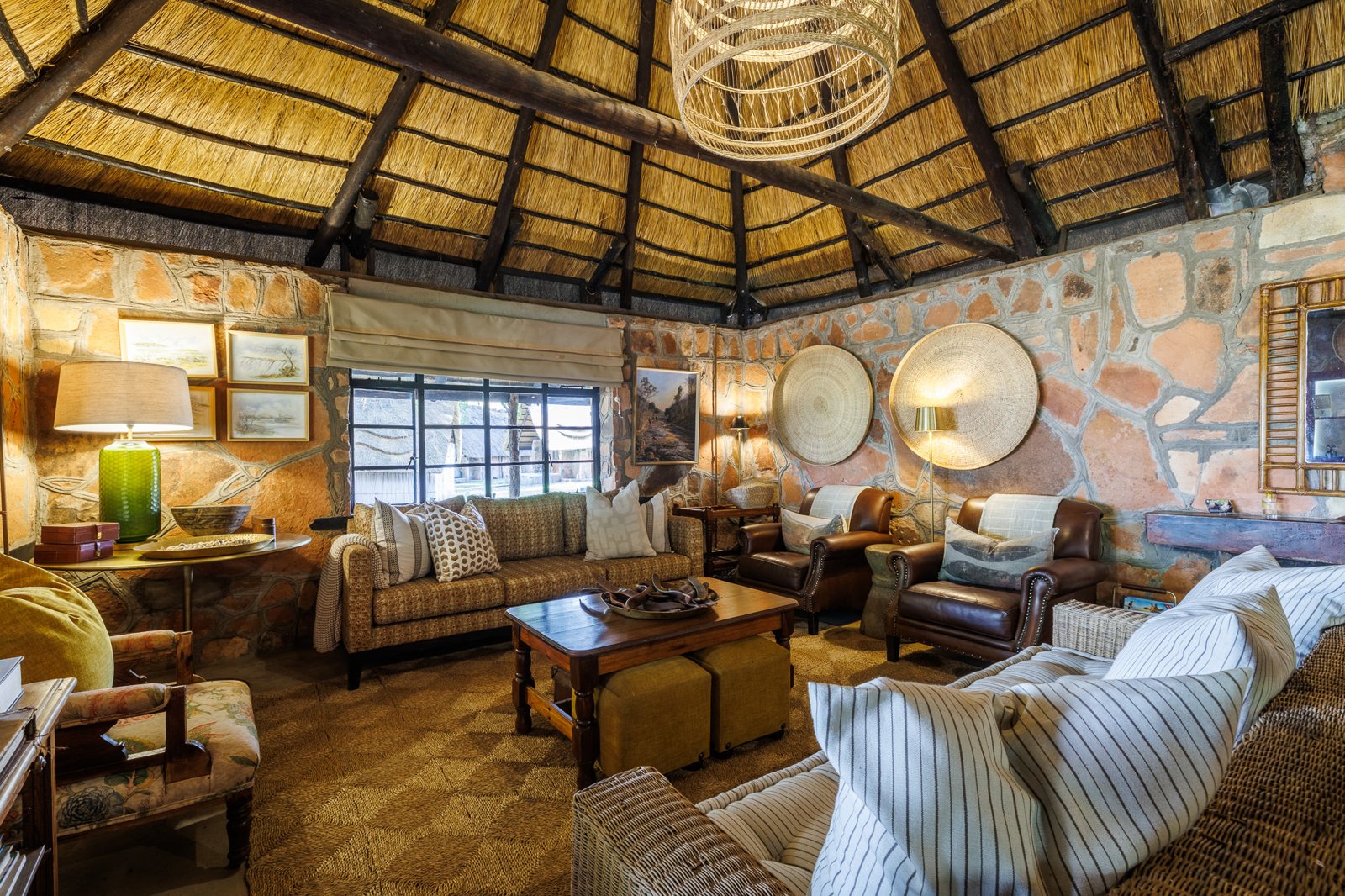 The thatched lounge with stone walls
