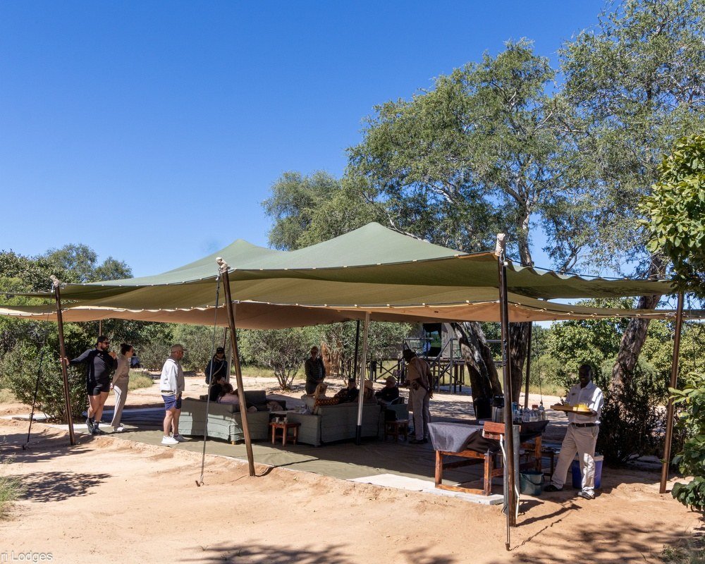 Jozibanini Camp's main area sits under a stretch tent, with tables and a lounge