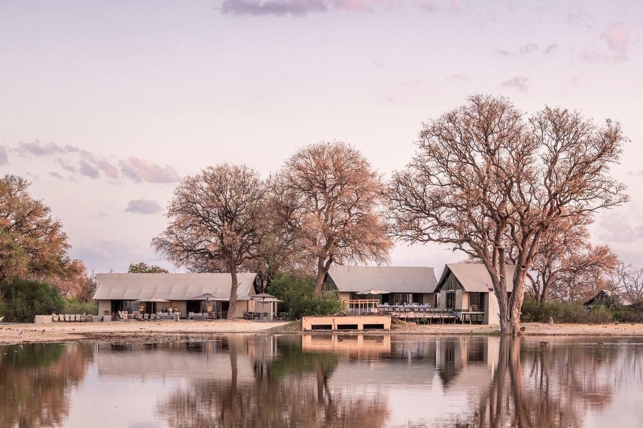Wilderness Linkwasha is reflected in the still water of the pan at dusk