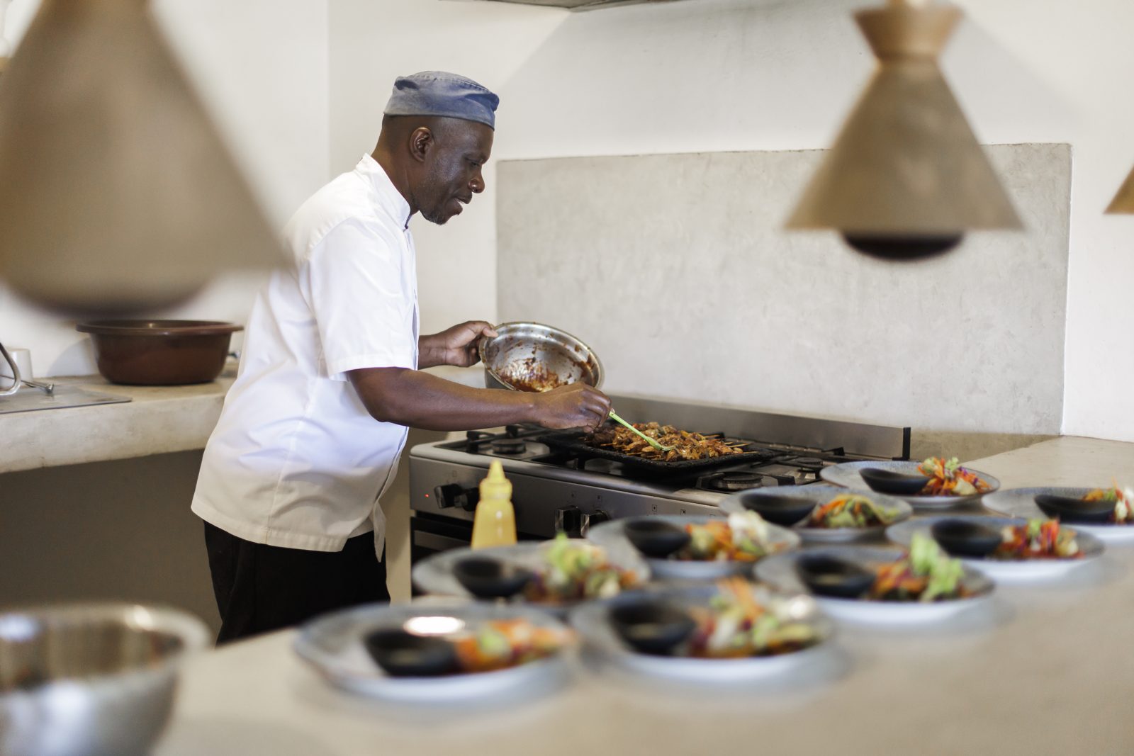 The chef plating up in the open kitchen