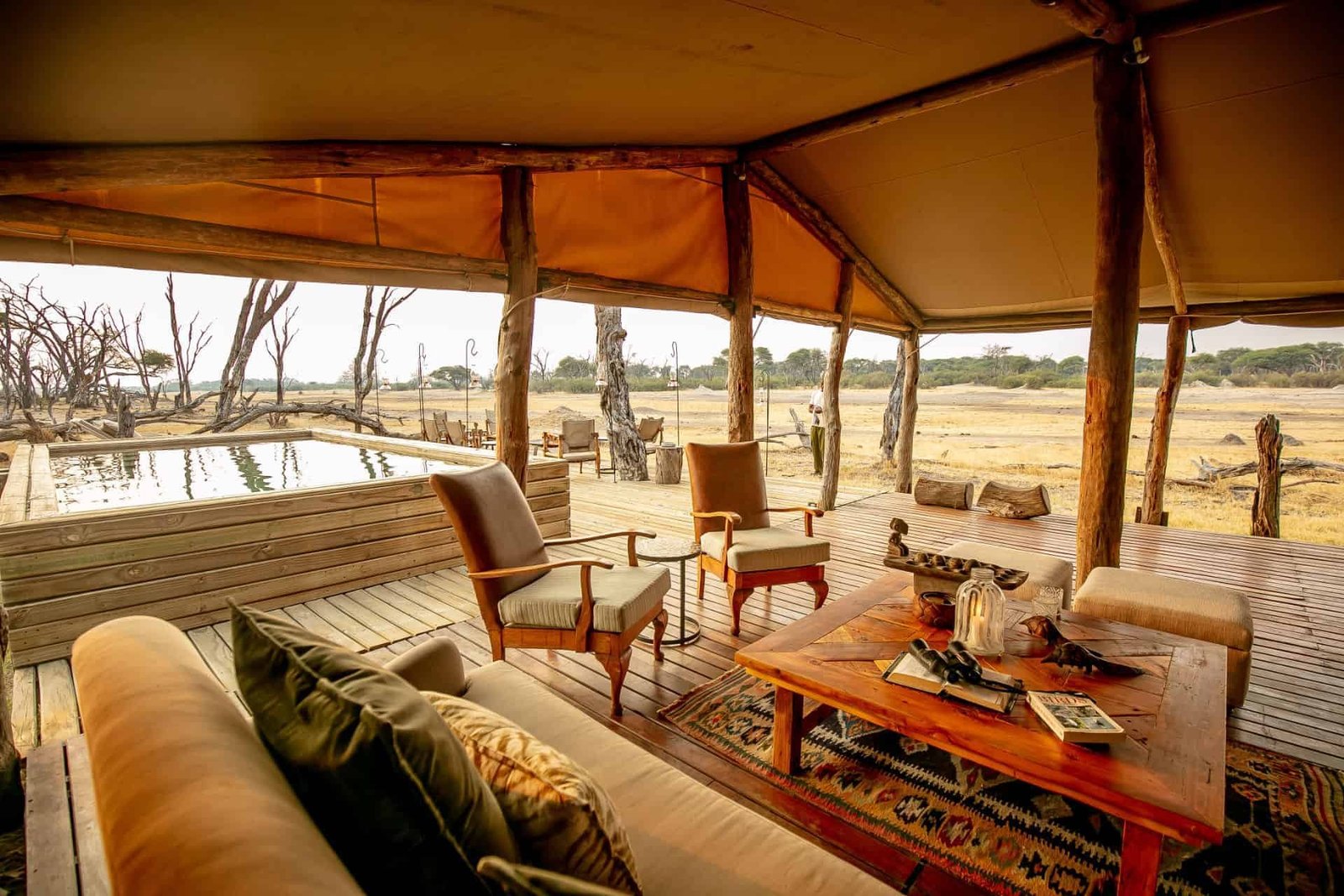 A tented suite's veranda and plunge pool overlook the pan at The Hide Safari Camp, Hwange