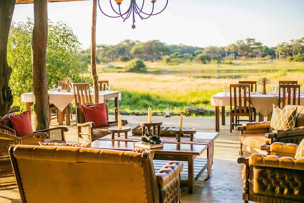The main lounge and dining deck at The Hide Safari Camp look out over open grassland